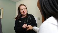 Rheumatologist specializing in lupus discusses treatment options with patient